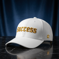 Success embroidered baseball cap in white with gold embroidery